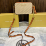 Michel Kor  jet set logo crossbody bag with tossel