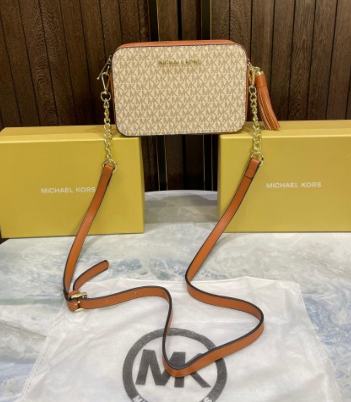 67 Michel Kor jet set logo crossbody bag with tossel - Image 1